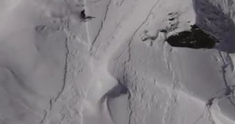 Skier manages to backflip his way out of an avalanche