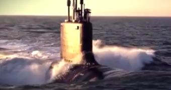Watch: Dolphins Swim Alongside US Navy Submarine