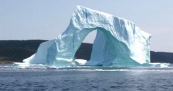 Video shows massive iceberg collapsing, most likely under its own weight