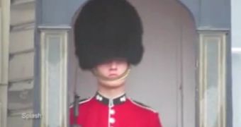 Member of the Queen's Guard filmed while making funny faces in front of the Buckingham Palace