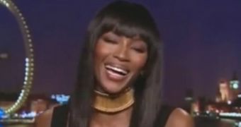 Naomi Campbell refuses to comment on the Kim and Kanye Vogue cover but can't help contain a fit of laughter at the question