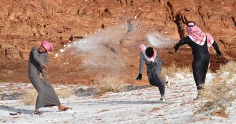 Young Saudi Arabians playing with snow