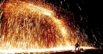 Festival in China has blacksmiths throw molten metals at a wall
