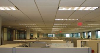 An image of a lot of cubicles that seem to go on forever