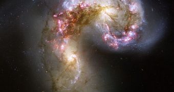 One of the most famous cases of galactic cannibalism, the Antennae Galaxies colliding