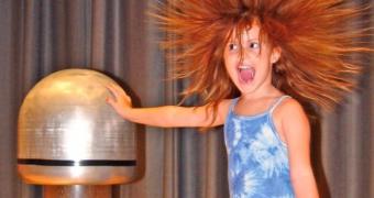 The 'hair raising' experience produced by the Van de Graaff generator, as electric charge is passed into a human body