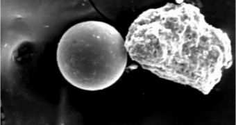 SEM image of an iron-oxide sphere of pollution produced by combustion, and collected with a double-sided tape collector