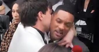 Reporter grabs Will Smith on the red carpet, tries to force a kiss on him