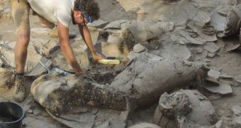 Researchers unearthing ancient wine jugs at a dig site in northern Israel