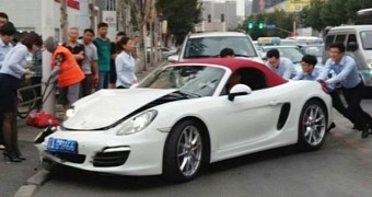 Woman in China crashes Porsche seconds after buying it