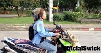Woman Rides Skull Scooter While Parrot Flies Beside Her – Video