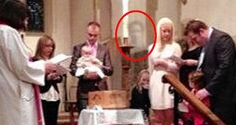 A woman believes she can spot her late husband's ghost in a picture