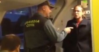 Officers ask the woman to get off the aircraft, as she pleas to be allowed to stay