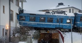 A cleaner steals a train, crashes it into a building