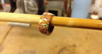 Creative craftsman makes a ring using a box of colored pencils