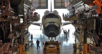 The space shuttle Discovery, parked inside the OPF, at the Kennedy Space Center