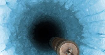 IceCube's optical detectors deployed in holes drilled in the Arctic ice