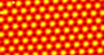 This is a scanning tunneling microscope image of the 2-atom-thick lead film. The inset is a zoomed view showing the atomic structure