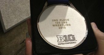 A second place wrestling medal gets tossed in the trash