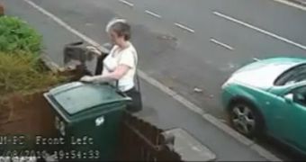 Mary Bale caught on camera as she throws a cat in a trash bin, right after petting her