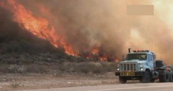A fire in the brush sweeps San Bernardino County
