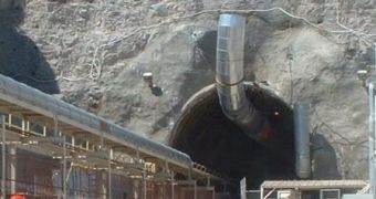 Visitors take a tour of the Yucca Mountain complex