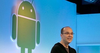 Andy Rubin next to the Android logo