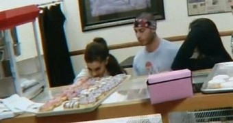 Ariana Grande puts her tongue on a donut on display in California shop, on a dare from her new boyfriend