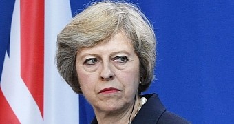 Theresa May asks for more power over Internet