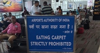 Airport sign warns travelers they must not eat carpets