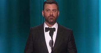 Jimmy Kimmel eats the envelope with the winner's name at the Emmys 2015