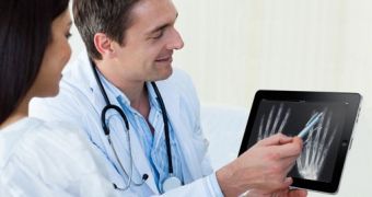 Physician shows off an x-ray on an Apple iPad