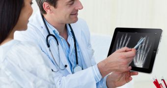 Physicians looking at x-rays on an iPad
