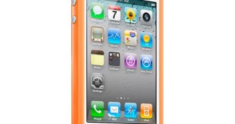 White iPhone 4 wearing an orange Bumper