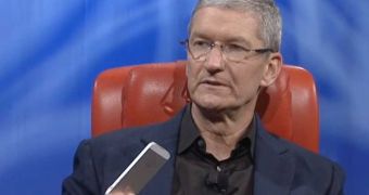 Apple CEO Tim Cook holding an iPhone