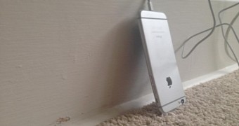 iPhone 6 charging against a wall