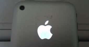 iPhone with glowing Apple logo