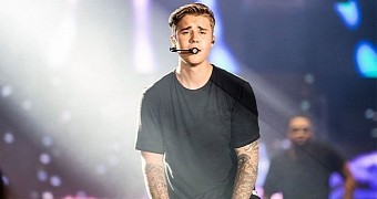 Justin Bieber admits he felt "violated" by leak of paparazzi photos of himself on vacation