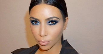 In between posting selfies, Kim Kardashian is pushing for gun control on Twitter