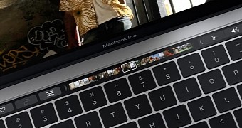 The Touch Bar is the first major step towards a touchscreen on the Mac, Hall says