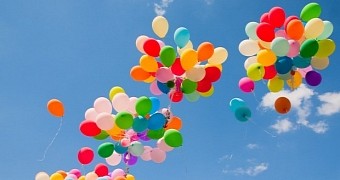 Dozens of Helium Balloons Fly Man High Up Over the Clouds