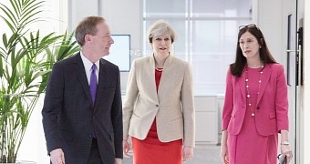 Microsoft President Brad Smith, Prime Minister Theresa May and Microsoft UK Chief Executive Cindy Rose