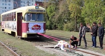 Russian woman pulls tram car