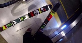 Video shows daredevil skiing down escalators