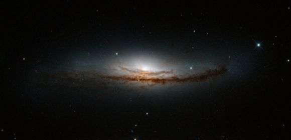 Hubble Sees Edge-on View of Beautiful Spiral Galaxy Nearby