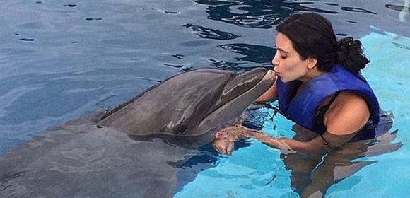 Kim Kardashian Goes Swimming with Dolphins, PETA Is Outraged