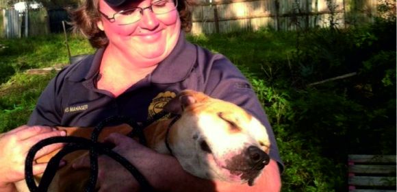 Photo of the Day: Animal Services Employee Cradles Rescued Pit Bull