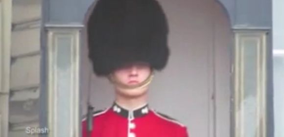 Watch: Member of the Queen's Guard Making Some Seriously Funny Faces