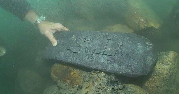 Photo shows the silver bar found by Barry Clifford and fellow explorers