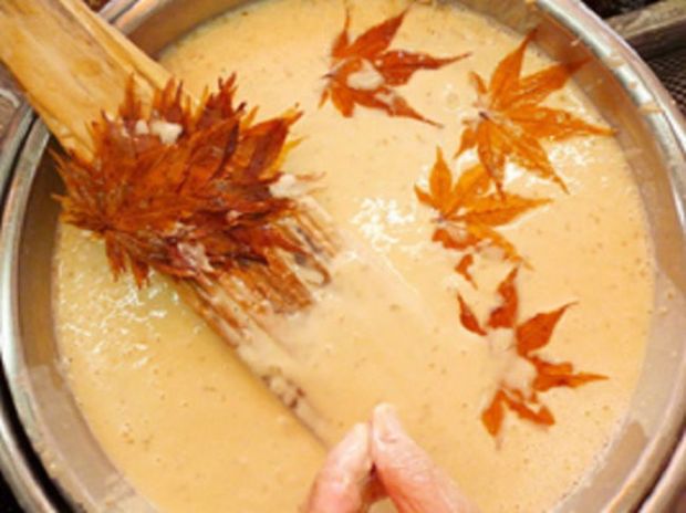 The leaves are dipped in a special batter before being fried